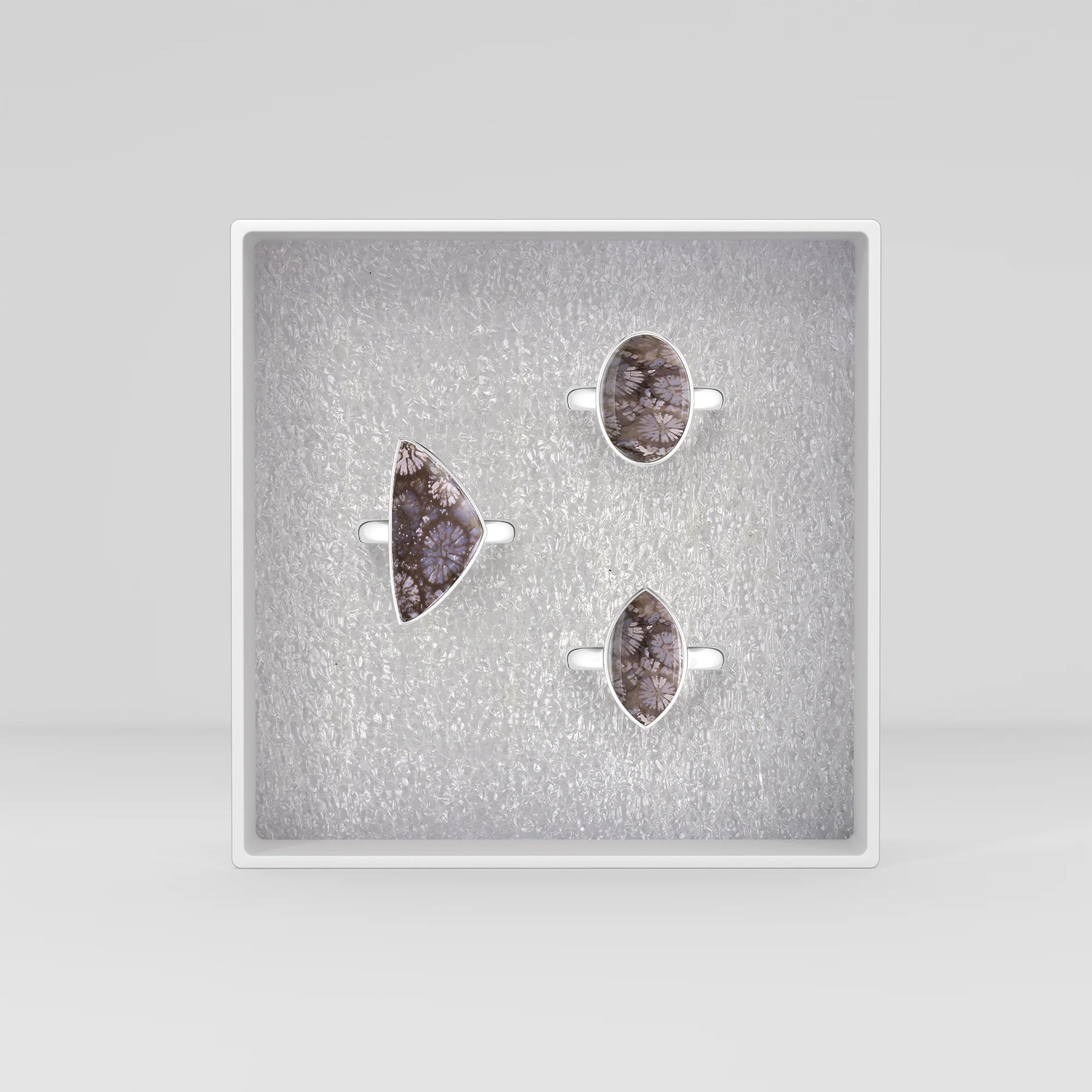 black-fossil-coral bezel-set ring